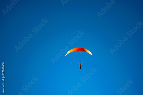 Paragliding in a blue sky