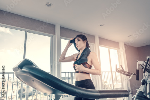 Fitness women running on track treadmill, exercise fitness. Fitness, gym, workout and lifestyle concept.