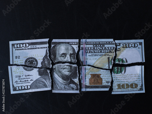 A torn hundred dollar bill