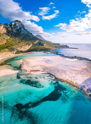 Fototapeta Naklejka Na Ścianę i Meble -  Amazing aerial view of Balos Lagoon with magical turquoise waters, lagoons, tropical beaches of pure white sand and Gramvousa island on Crete, Greece