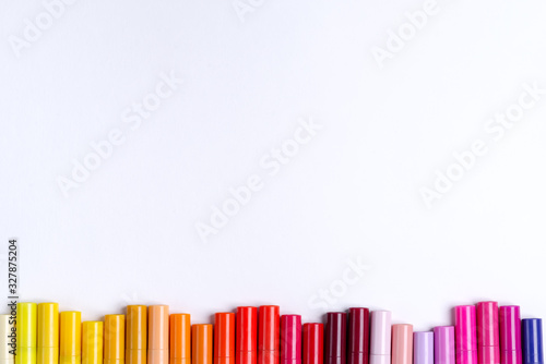 Painting multicolored border wave from colorful markers for art creativity on a white background. Flat lay