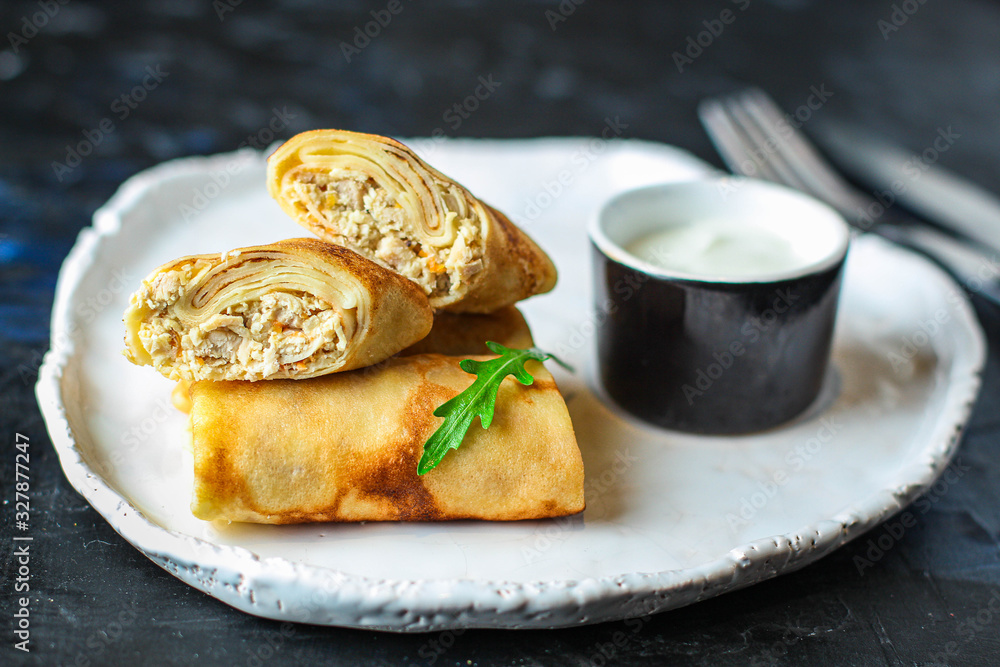 thin pancakes or crepes stuffed chicken meat and vegetables (hen or turkey) menu concept background. top view. copy spaces thin pancakes or crepes stuffed chicken meat and vegetables (hen or turkey) menu concept background. top view. copy spaces