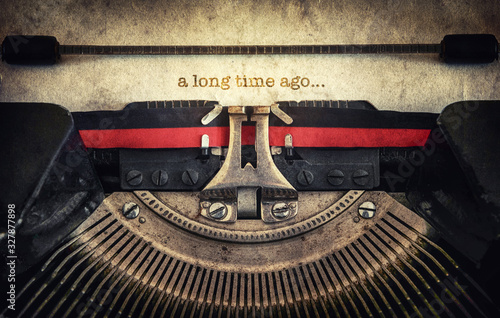 A long time ago typed on old vintage typewriter machine. Retro style.