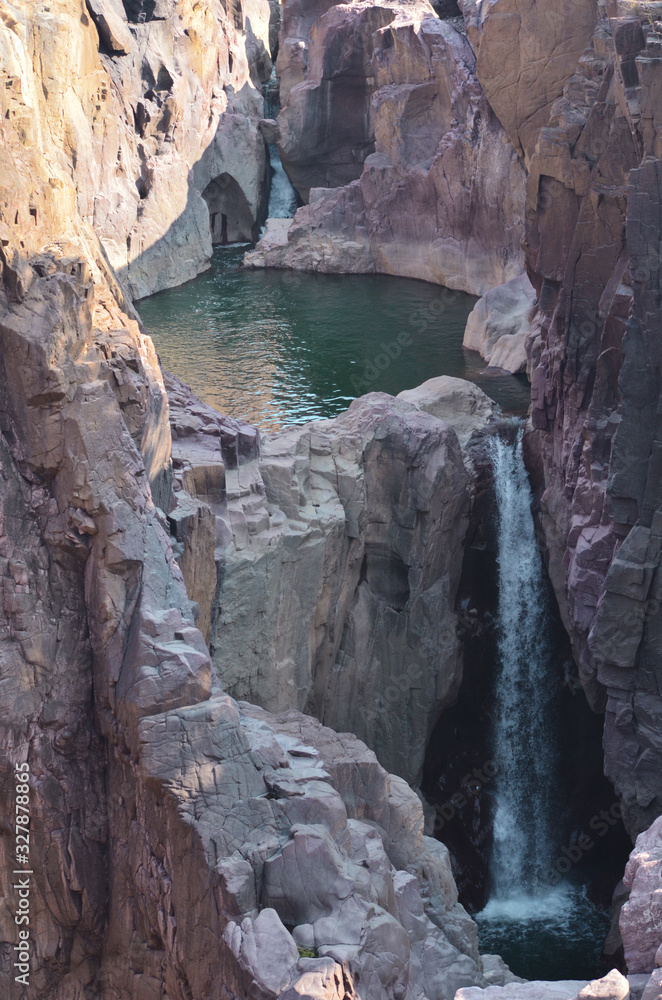small waterfall in mountains green water small waterfall in mountains green water