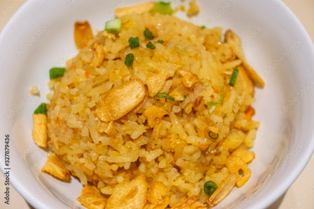 Garlic fried rice with vegetable in a bowl Garlic fried rice with vegetable in a bowl