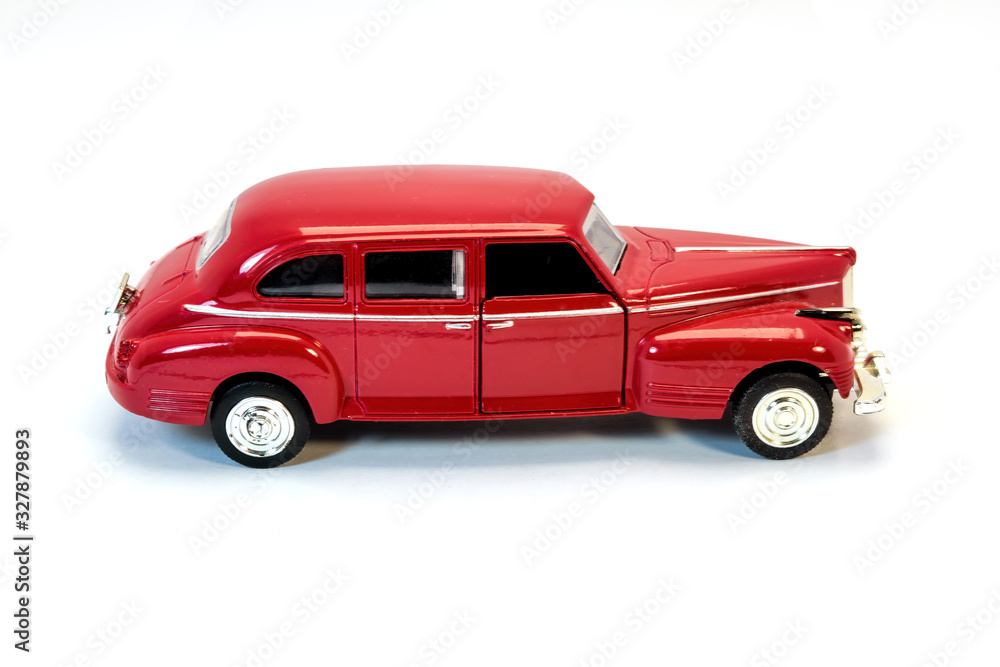 Children's toy car of red color. Children's toy car isolated on white background.