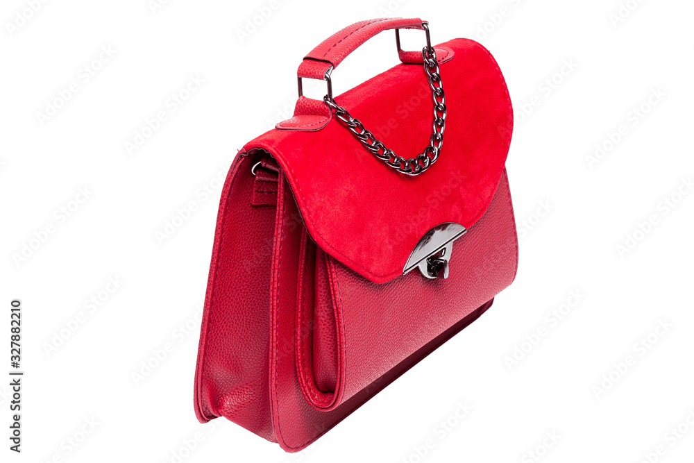 lady handbag in red leather and suede with a handle and a decorative chain, half turn side view isolated on a white background. lady handbag in red leather and suede with a handle and a decorative chain, half turn side view isolated on a white background.