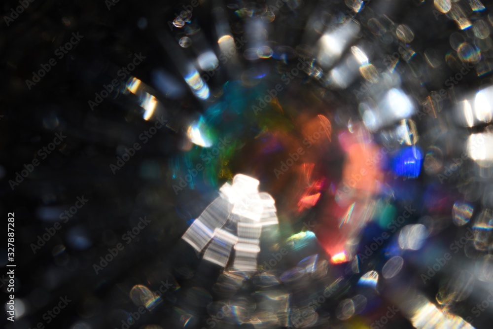 Colorful light leaks and bokeh, an abstract image with a number of different light effects, arranged in a circle 