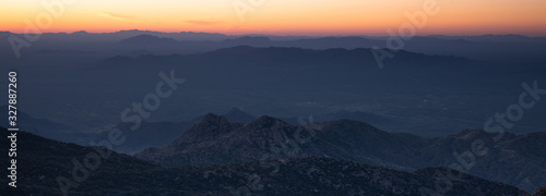 Colorful orange sunset from Kitt Peak Observatory over Arizona desert hills © Dawn
