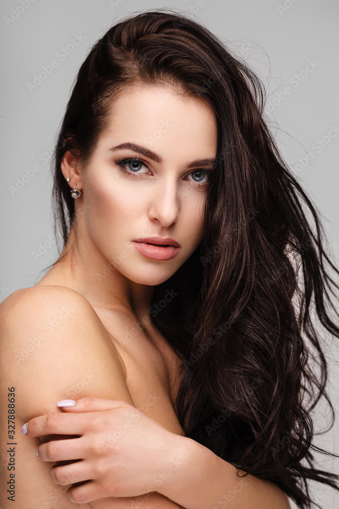 © Maksim Toome - portrait of a young lady with beautiful brunette hair on grey © Maksim Toome - portrait of a young lady with beautiful brunette hair on grey
