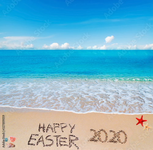 happy easter 2020 on a tropical beach under clouds