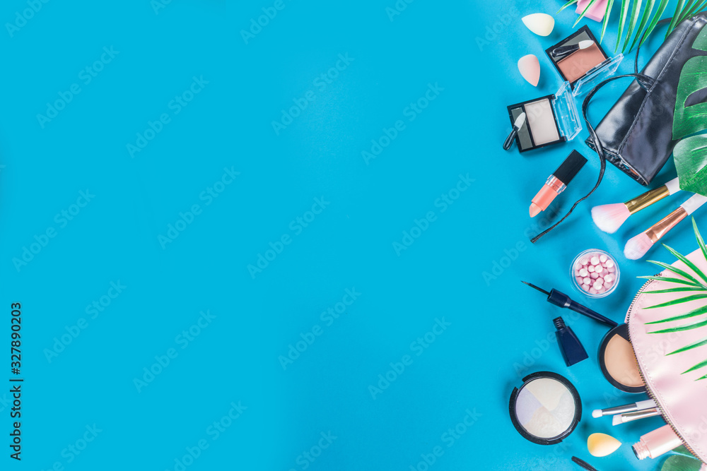 Fototapeta premium Professional makeup cosmetic set, with summer tropical leaves, woman bag. Make up items. luxury decorative cosmetics flatlay, top view, mockup. Beauty blogger concept. Trendy turquoise background