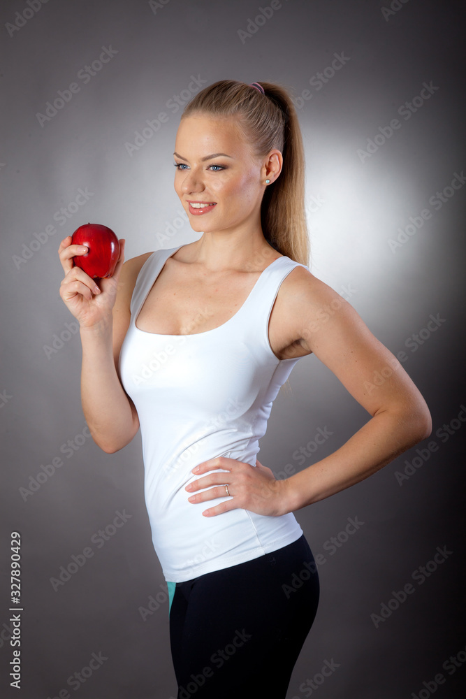 a beautiful and elegant woman eats an Apple to maintain a slim figure a beautiful and elegant woman eats an Apple to maintain a slim figure