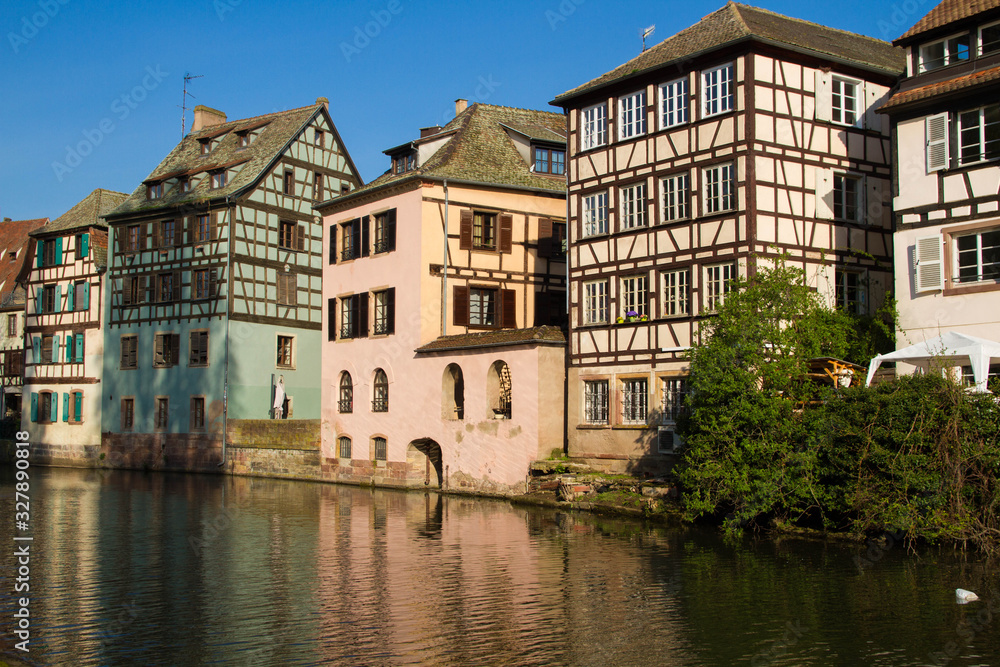 Medieval traditional half-timbered houses in the Petite France district. Pastel colors of early spring.  Strasbourg, Alsace, France.