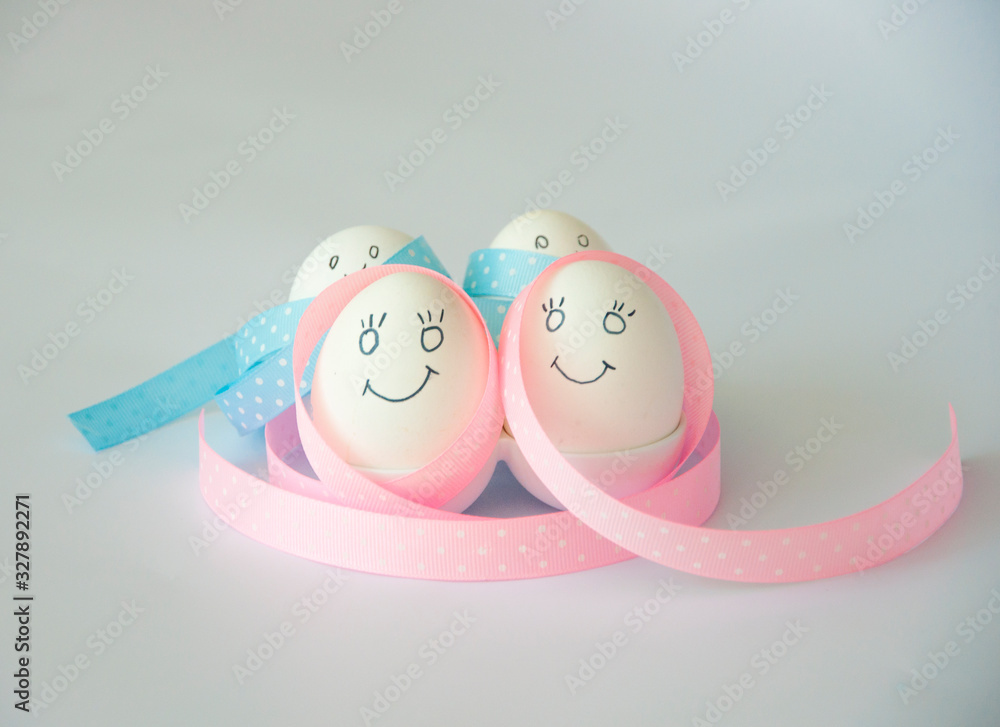 White eggs with color ribbon on white background. Happy easter. New life concept. Holiday card. White eggs with color ribbon on white background. Happy easter. New life concept. Holiday card.