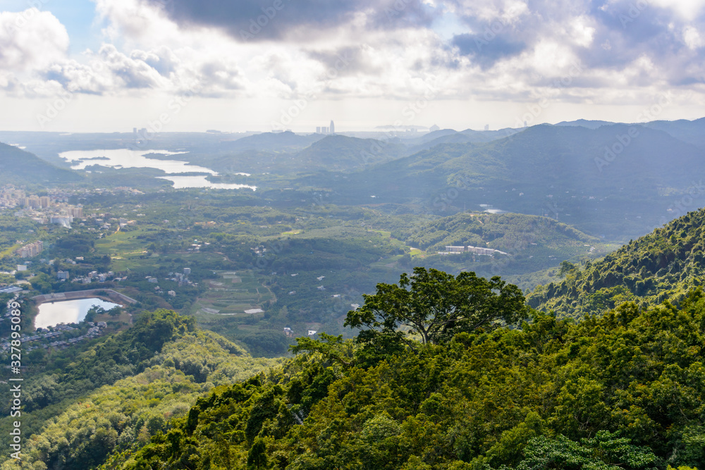 Fototapeta premium Panoramic view to mountains, tropical forest, Yanoda Park and Sanya city. Rainforest cultural tourism zone Yanoda, Hainan, China.