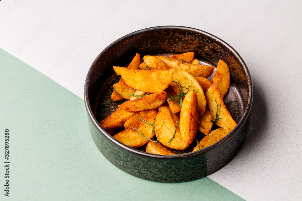 plate with fried potato on color background. menu concept plate with fried potato on color background. menu concept