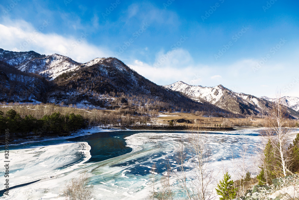 Winter landscape, the Katun river flows among the Altai mountains. Altai Republic, Russia