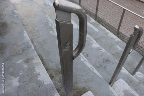 metal railings and concrete ground view photo