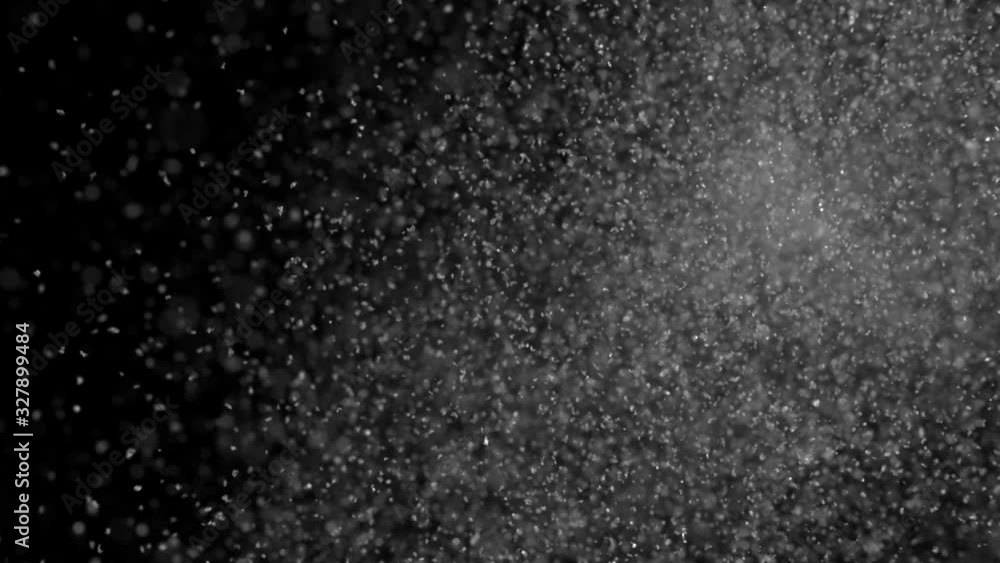 Falling snow particles isolated on black background Falling snow particles isolated on black background