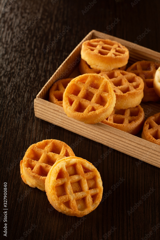 Waffle round-shaped biscuits on the table in a box Waffle round-shaped biscuits on the table in a box