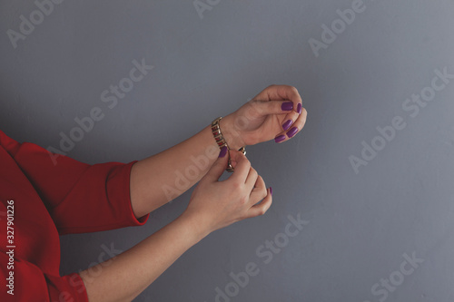 woman hand holding red watch