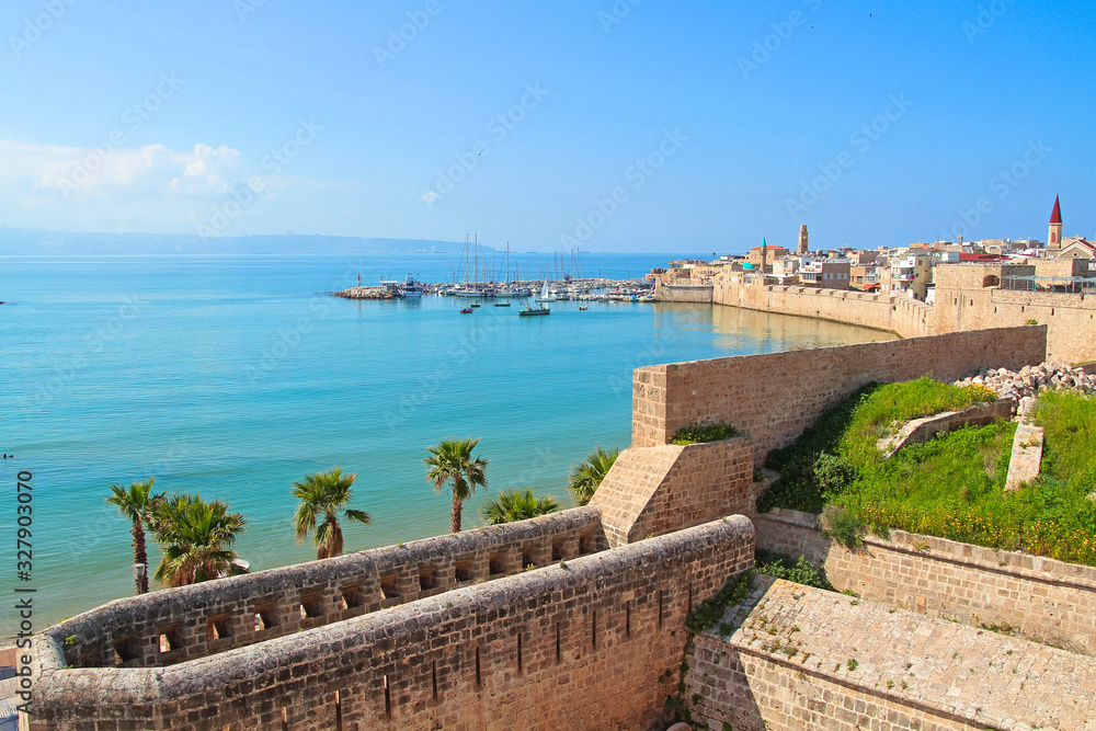 Old Akko Walls. Panoramic view of Mediterranean sea, old city, harbour, port, mountains on the horizon. Acre, Isarel.
