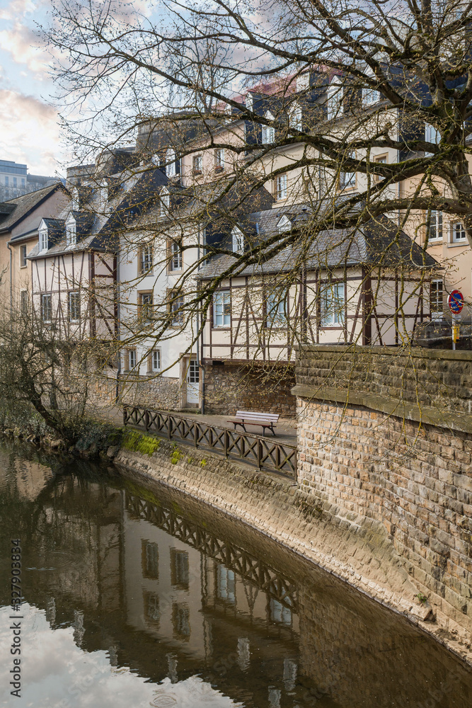 View of colorful living houses. Reflection in the Alzette river. Grund, Luxembourg. Beautiful spring nature. View of colorful living houses. Reflection in the Alzette river. Grund, Luxembourg. Beautiful spring nature.