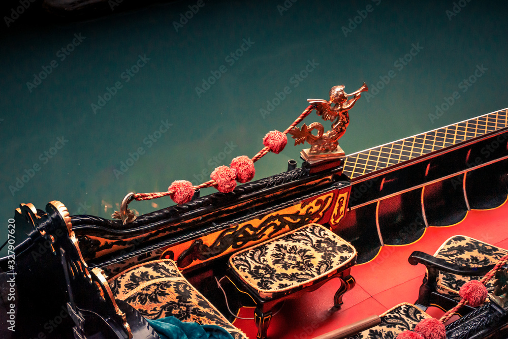 gondola interior of red and gold on a venice canal