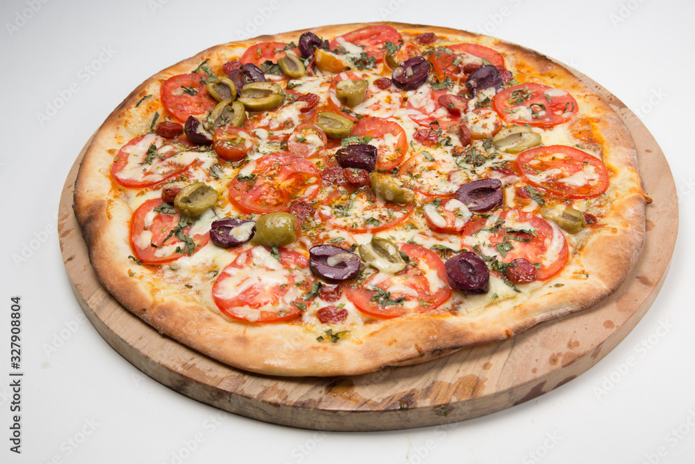 Vegetarian pizza or pizza with onions, mixed olives, mushrooms  and tomato with a white background