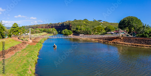 Aerial drone view of the wooden swinging bridge of Hanapepe over the river on Kauai