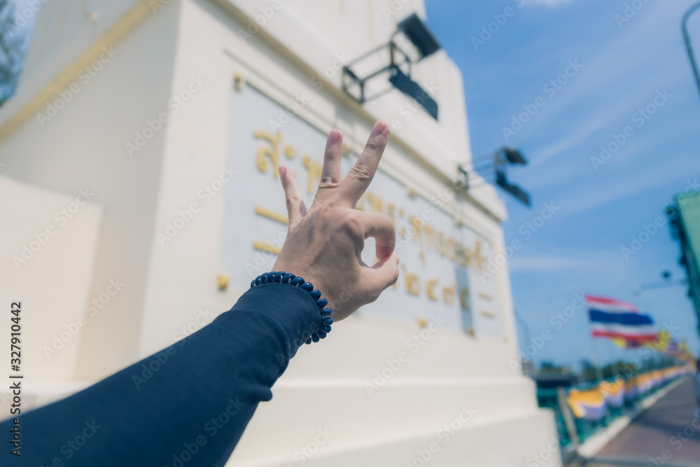 Symbol hand on city background Symbol hand on city background