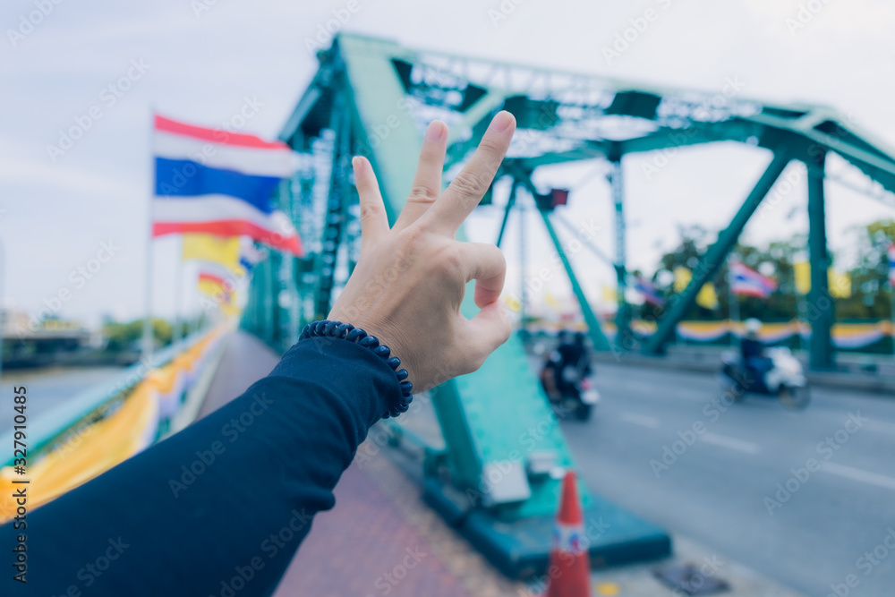 Naklejka premium Symbol hand on city background