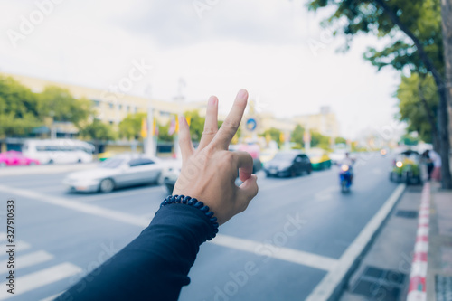 Symbol hand on city background