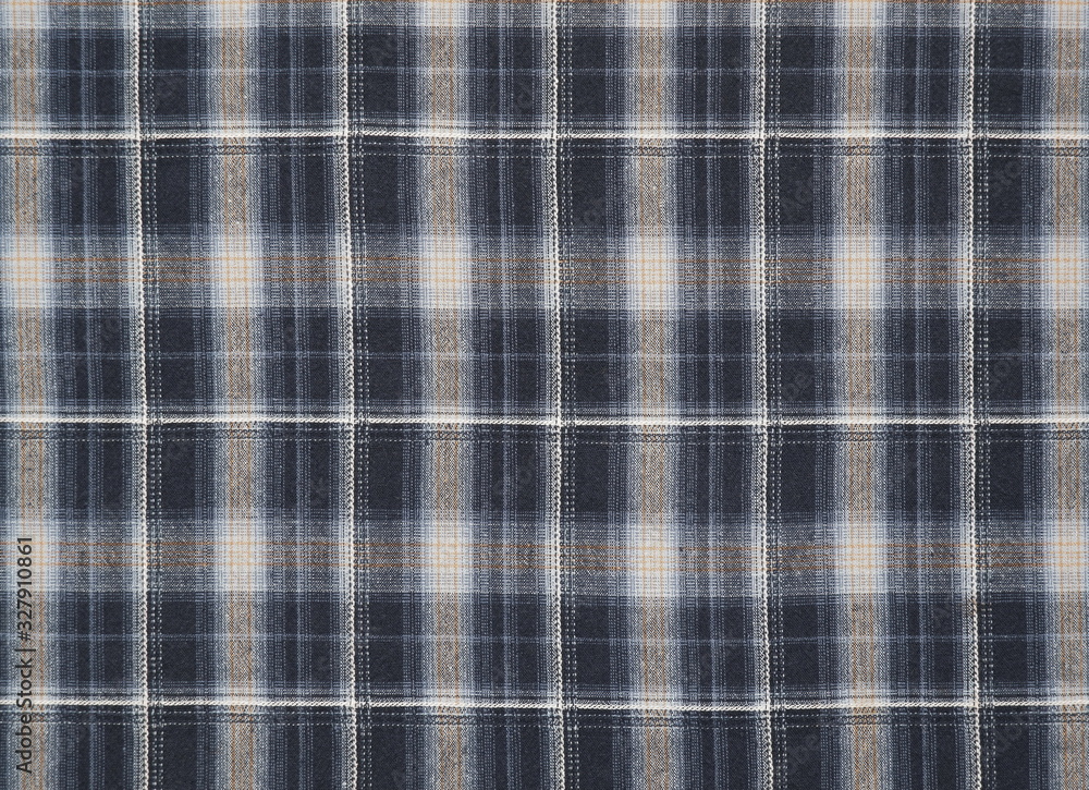 Blue grey checkered plaid pattern fabric cotton texture background.