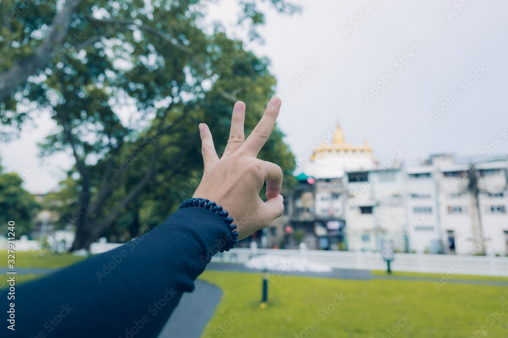 Symbol hand on city background