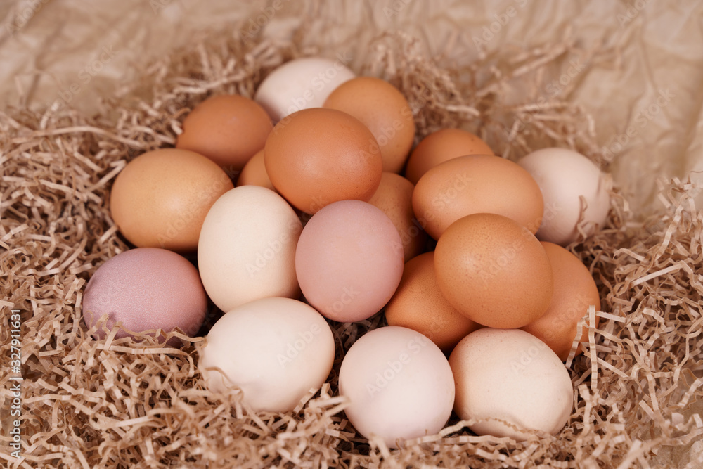 Village eggs. Kraft paper background Village eggs. Kraft paper background