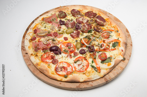 Salami pizza with mushrooms, onions, green olives and tomato with white background
