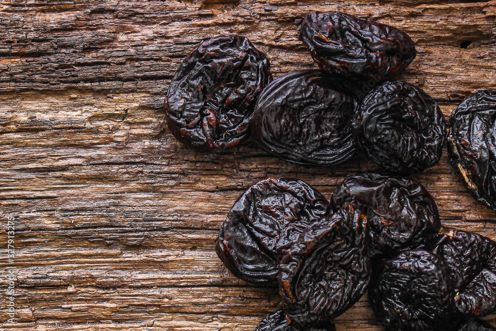 prunes, dried plums (tasty and healthy fruits) desiccated keto or paleo diet menu concept. background. top view. copy space prunes, dried plums (tasty and healthy fruits) desiccated keto or paleo diet menu concept. background. top view. copy space