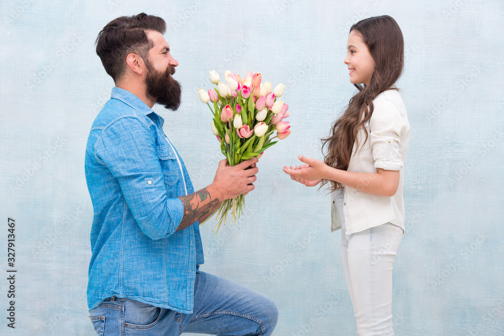 Flower shop. Family tradition. Little lady. Tender tulips for daughter. Man tulips bouquet. Father giving tulips girl. Dad with flowers. Birthday celebration. International womens day. Fathers day