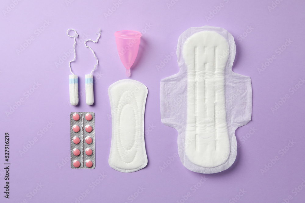 Flat lay with menstruation period concept on violet background, top view