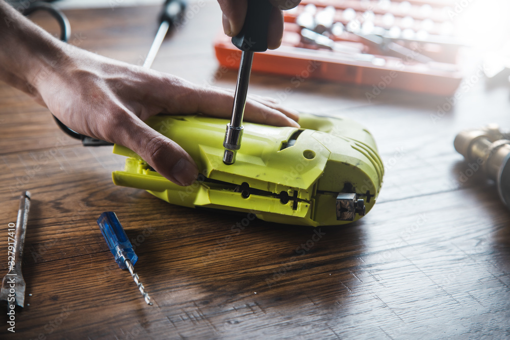 Fototapeta premium man to repair jigsaw