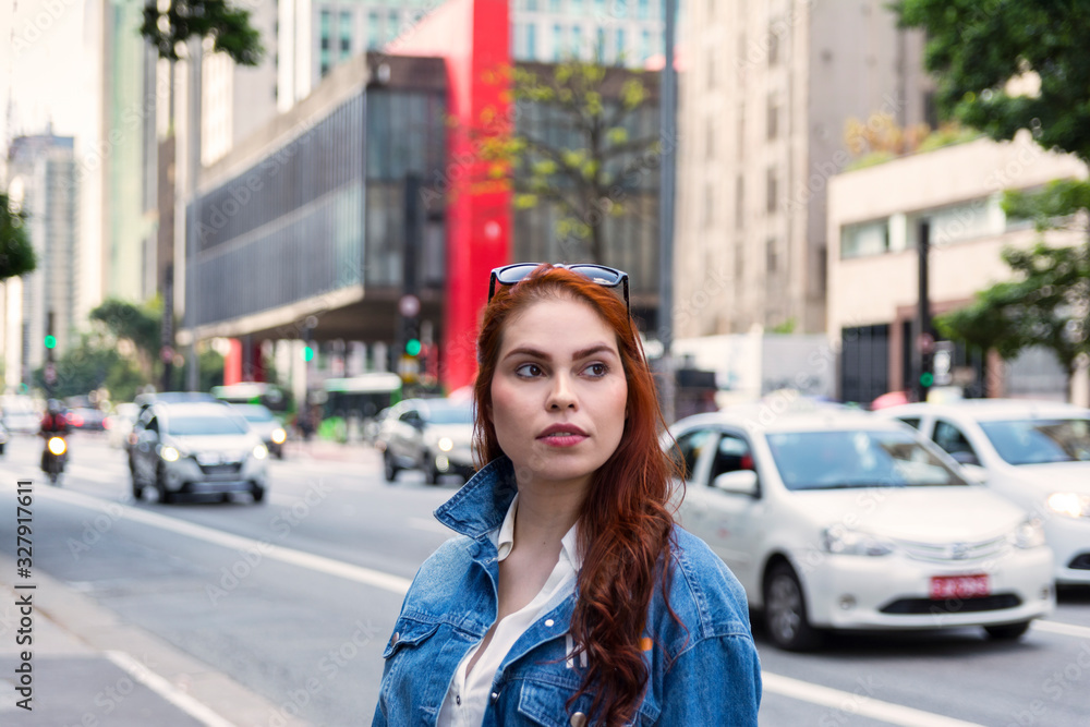Beautiful redhead woman at Paulista Avenue (Avenida Paulista), São Paulo, Brazil