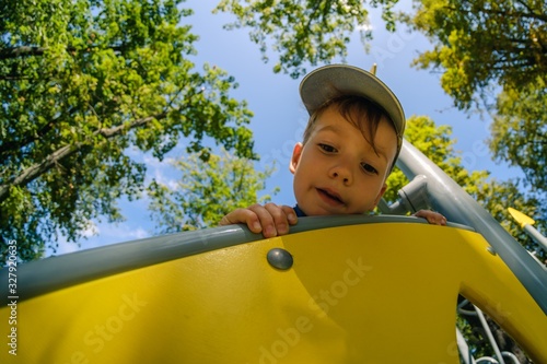 Happy boy on playground, su...