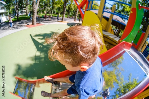 Happy boy on playground, su...