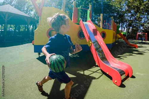 Happy boy on playground, su...