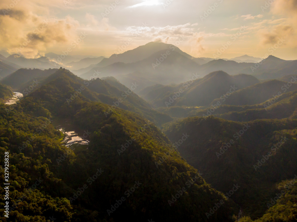 Tropical mountains in sunrise light and fog in beautiful colors