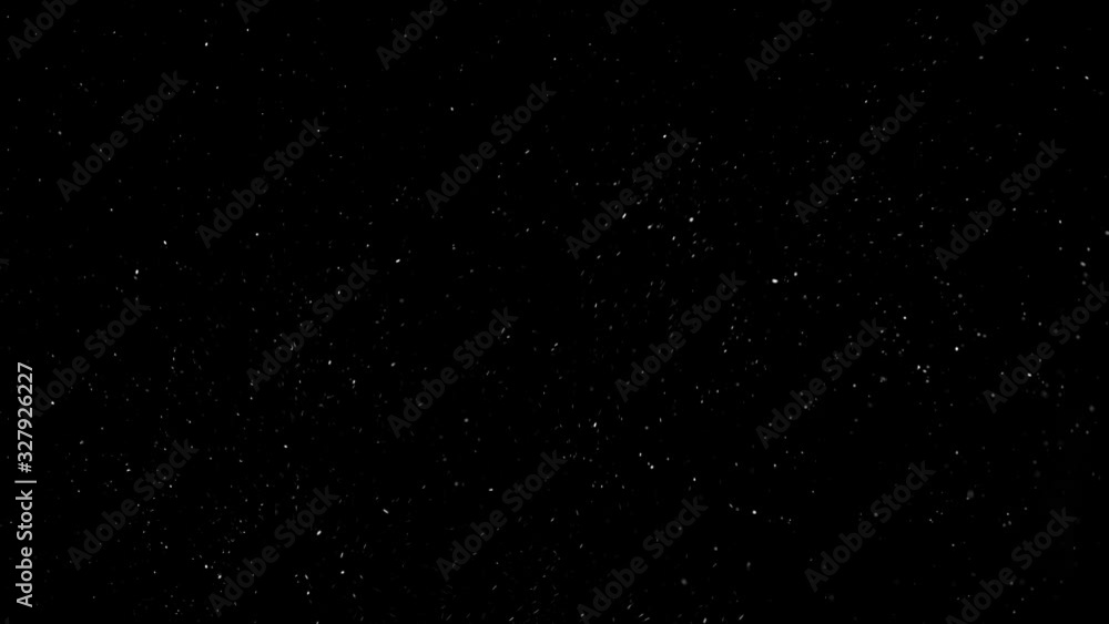 Flurry of snow particles isolated on a black background Flurry of snow particles isolated on a black background