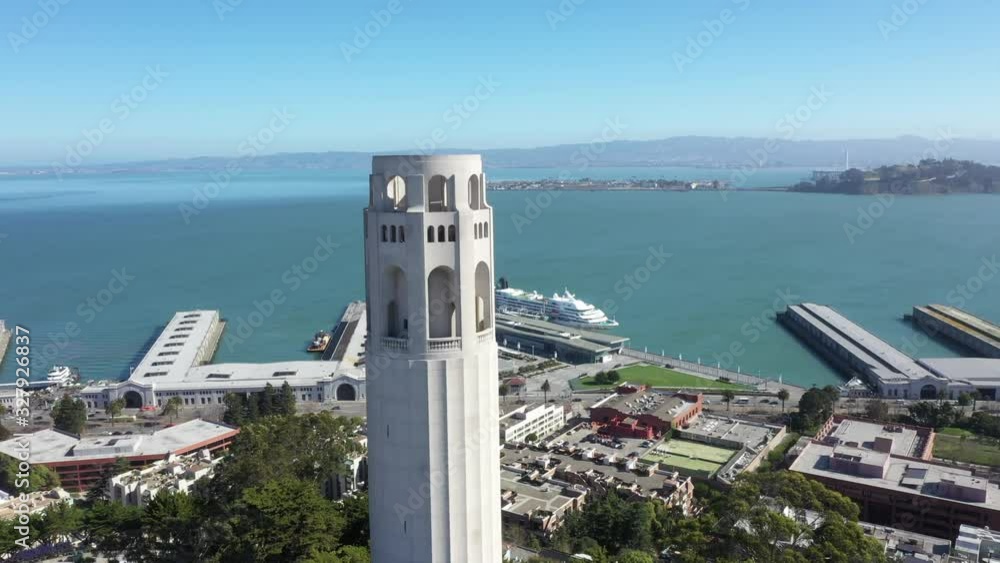 Coit Tower in San Francisco, California, USA, as seen from above. Rotating view around tower with Golden Gate Bridge in background , as well as Alcatraz and the TransAmerica Pyramid. Coit Tower in San Francisco, California, USA, as seen from above. Rotating view around tower with Golden Gate Bridge in background , as well as Alcatraz and the TransAmerica Pyramid.