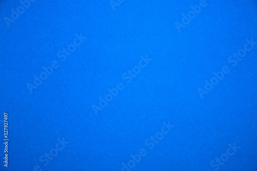 Bright blue background.Red cardboard texture.